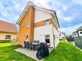 Gebäuderückseite - Einfamilienhaus mit 147,00 m² in Leipzig zum Kaufen