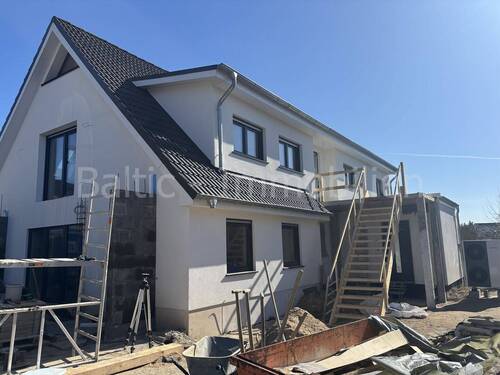 Außenansicht - Sanierte Dachgeschosswohnung mit neuer Einbauküche und Wärmepumpe !