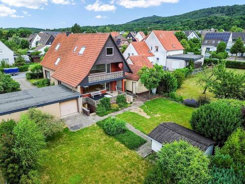 Hinteransicht & Garten - 9 Zimmer Mehrfamilienhaus, Wohnhaus zum Kaufen in Steinhagen