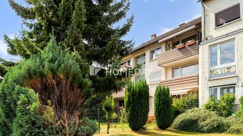 Außenansicht 2 - Drei Zimmer, klarer Schnitt: Ihr neues Zuhause mit Loggia und Garage