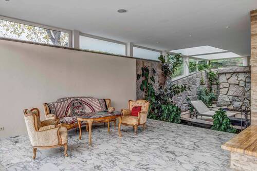 Wohnzimmer mit Tropfatrium EG - 