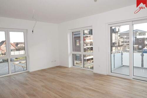Wohn- und Essbereich mir Zugang zum Balkon - Lichtdurchflutete Obergeschosswohnung in zentraler Lage von Wiesmoor! Neubau- Erstbezug