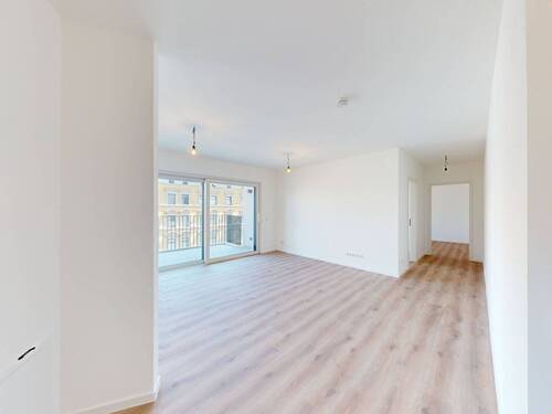 Ansicht III: Wohn- und Esszimmer mit offenem Küchenbereich - 