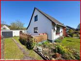 Süd-West-Ansicht mit Terrasse und Garage - 4 Zimmer Einfamilienhaus zum Kaufen in Jagel
