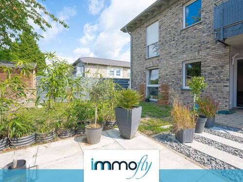 Gartenansicht - Erdgeschosswohnung mit privatem Garten und angenehmer Wohnatmosphäre - ideal für Paare und Singles