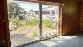 Wohnzimmer mit Blick in den Garten - 