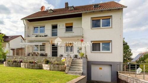 Außenansicht 1 - Voll vermietetes Mehrfamilienhaus mit großem Garten, Terrasse und Loggia in idyllischer Lage