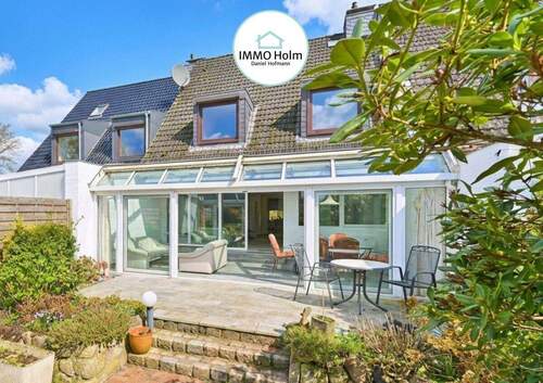 Bild 1 - Großzügiges Reihenmittelhaus mit schönem Wintergarten in Holm!