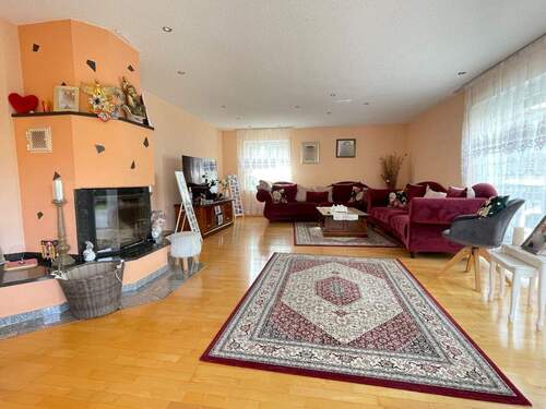 Wohnzimmer mit Kamin - Einfamilienhaus mit 346,00 m&sup2; in Konstanz zum Kaufen