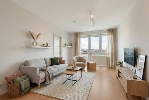 Wohnen (Einrichtungsbeispiel) - Gemütlicher Wohntraum: 2-Zimmer-Neubau im 6. OG mit Ost-Balkon, Concierge, Lift & TG-Stellplatz