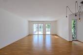 EG: Wohnzimmer - Terrassenwohnung mit 122,00 m² in Karben zum Kaufen