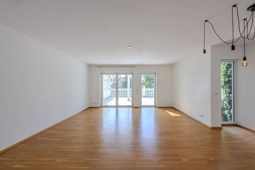 EG: Wohnzimmer - Terrassenwohnung mit 122,00 m² in Karben zum Kaufen