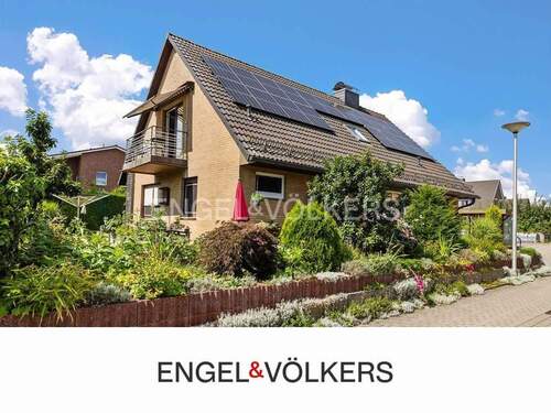 Titelbild mit Logo - Energieeffizientes Einfamilienhaus mit Garten und Doppelgarage