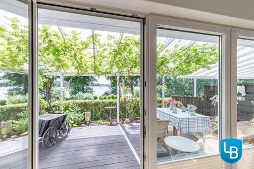 Blick aus dem Wohnzimmer - Doppelhaushälfte mit 104,00 m² in Stocksee zum Kaufen