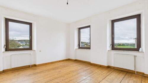 Wohnzimmer - 6 Zimmer Einfamilienhaus zum Kaufen in Helfant