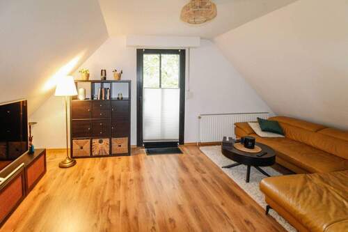 Wohnzimmer ELW mit Loggia-Zugang - 