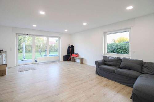 Wohnzimmer - Mehrfamilienhaus, Wohnhaus mit 160,50 m&sup2; in Neuenkirchen zum Kaufen