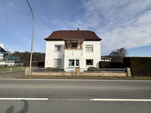 Straßenansicht - 9 Zimmer Einfamilienhaus zum Kaufen in Leopoldshöhe / Bexterhagen