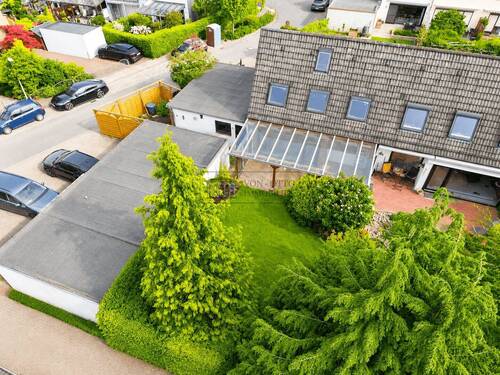 Gartenansicht - Wohlfühloase für die Familie: Geräumiges Reihenendhaus mit 5 Zimmern und grossem Aussenbereich