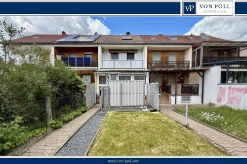 Titelbild - Top gepflegtes Reihenhaus mit Extra-Grundstück inkl. Garage und Nebengebäude