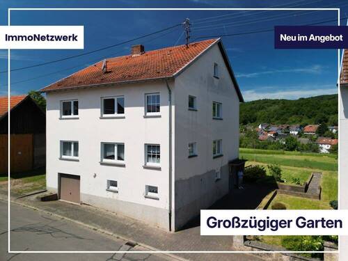Titelbild - Gartenparadies mit Weitblick - großzügiges Zweifamilienhaus in Krottelbach