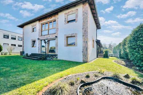 Titelbild - Charmantes Holzhaus trifft modernen Neubau - Ruhige Sackgassenlage in Holle - Erbpacht