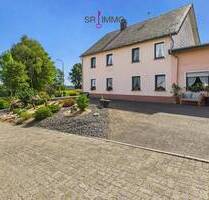 Gepflegtes Einfamilienhaus mit Hobbywerkstatt in Jucken