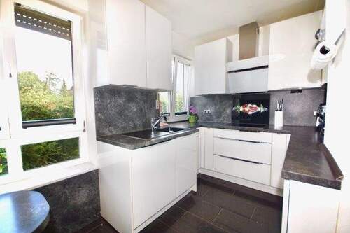 Küche im Erdgeschoss - Etagenwohnung mit 72,80 m² in München zum Kaufen