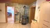 Eingangsbereich mit Schwedenofen - 2 Zimmer Etagenwohnung in Bad Peterstal-Griesbach