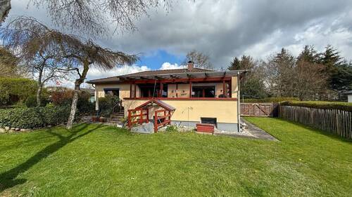 Rückansicht mit überdachter Terrasse - 4 Zimmer Einfamilienhaus zum Kaufen in Handewitt