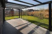 Wintergarten mit Schiebeelementen - Familienoase vor Sylt: Moderne KfW-40 Doppelhaushälfte mit Wintergarten in Klanxbüll