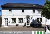 Bild 1 - Flexibel und außergewöhnlich: Wohn- und Geschäftshaus mit zusätzlichem Wohn- und Wirtschaftsgebäude