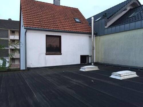 Rückansicht mit Flachdach - Mehrfamilienhaus, Wohnhaus mit 161,00 m² in Köln zum Kaufen