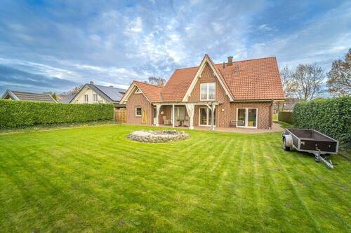 Garten - Einfamilienhaus mit 190,40 m&sup2; in Herzlake zum Kaufen