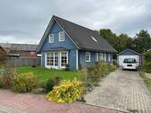 Außenansicht/Auffahrt - Holzhaus mit perfekter Raumaufteilung, gepflegtem Garten und energetisch gut ausgerichtet