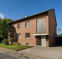 Mehrfamilienhaus mit großem Garten, Garage und Gewerbeeinheit - Rommerskirchen Anstel