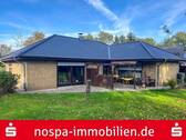 Gartenansicht - Gepflegter Winkelbungalow mit Südwest-Terrasse und massiver Garage in Drelsdorf
