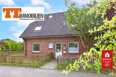 Außenansicht - TT bietet an: Ebenerdige 3-Zimmer-Wohnung mit Terrasse und Garage in Neuengroden!