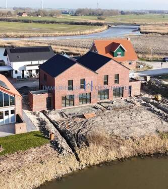 Ansicht - M 607: NUR NOCH EINE HÄLFTE VERFÜGBAR! Unverbaubarer Blick! Moderne und energieeffizienten Doppelhaushälfte mit Carport in Neuharlingerlsiel!