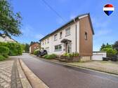 REMAX Immobilien DeLux Einfamilienhaus Frontansicht Merchweiler Mark Borowicz - 