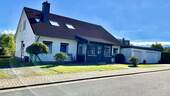 Seitliche Hausansicht - Mehrfamilienhaus, Wohnhaus mit 190,80 m² in Lamspringe OT Harbarnsen zum Kaufen
