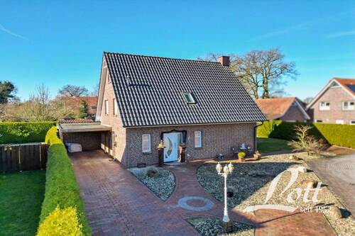 Bild 1 - +++ Einfamilienhaus mit Carport in familienfreundlicher Sackgassenlage in Apen +++