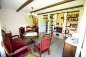 Wohnzimmer mit Kamin und Blick in Esszimmer - Mehrfamilienhaus, Wohnhaus mit 189,00 m&sup2; in Laer zum Kaufen