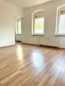 Wohnbereich mit Blick in die Küche - Etagenwohnung mit 40,00 m&sup2; in Fürth zur Miete