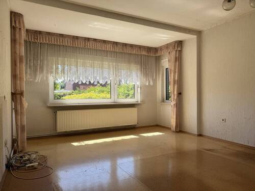 Wohnzimmer - Einfamilienhaus mit 141,00 m² in Großefehn zum Kaufen
