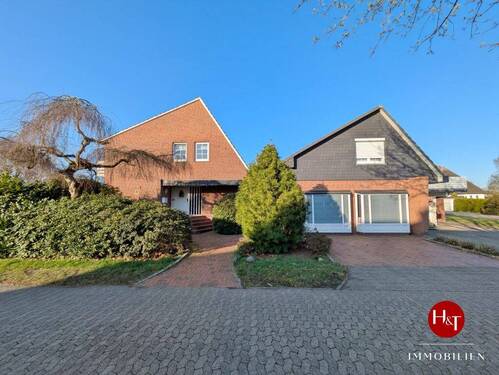 Haus kaufen in Weyhe Erichshof - Hechler & Twachtmann Immobilien GmbH - Familienidyll mit Vermietungspotenzial in Weyhe-Erichshof!