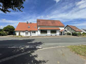 Gebäudeansicht von Straße - Wohn- und Geschäftshaus in Hille