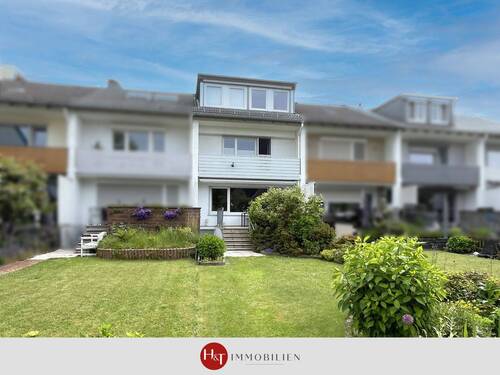 H&T Immobilien - Reihenhaus in Stuhr - Charmantes Reihenmittelhaus mit Garage und gepflegtem Garten