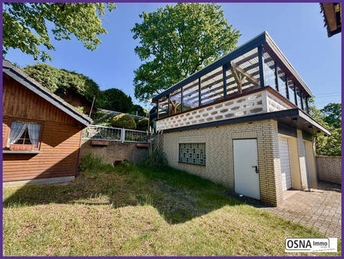 Garten mit seitlicher Garagenansicht - 