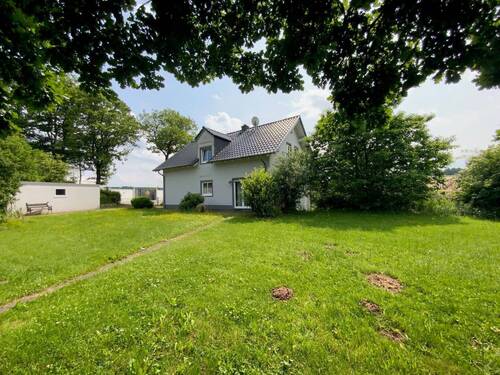 Rückansicht - Mehrfamilienhaus, Wohnhaus mit 168,00 m&sup2; in Neuheilenbach zum Kaufen